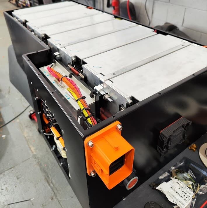 Engineer carrying out EV diagnostics and CAN bus integration work